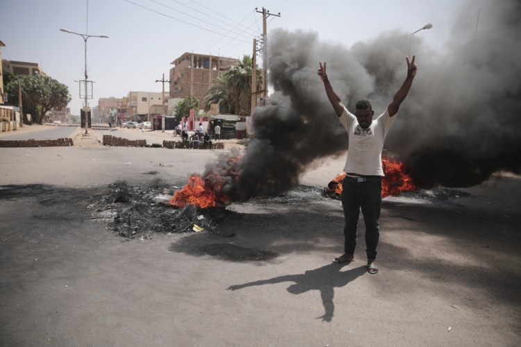 People burn tires during a protest a day after the military seized power in Khartoum, Sudan, on Tuesday.