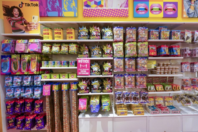A column of candy, left, featured in TikTok videos is displayed at It'Sugar candy store Oct. 6 on the Upper East Side of New York.