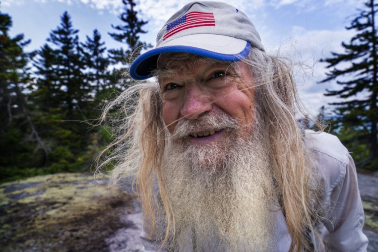 M.J. Eberhart, 83, arrives on the summit of Mount Hayes on the Appalachian Trail on Sept. 12 in Gorham, New Hampshire. Eberhart, who goes by the trail name of Nimblewill Nomad, is the oldest person to hike the entire 2,193-mile Appalachian Trail.