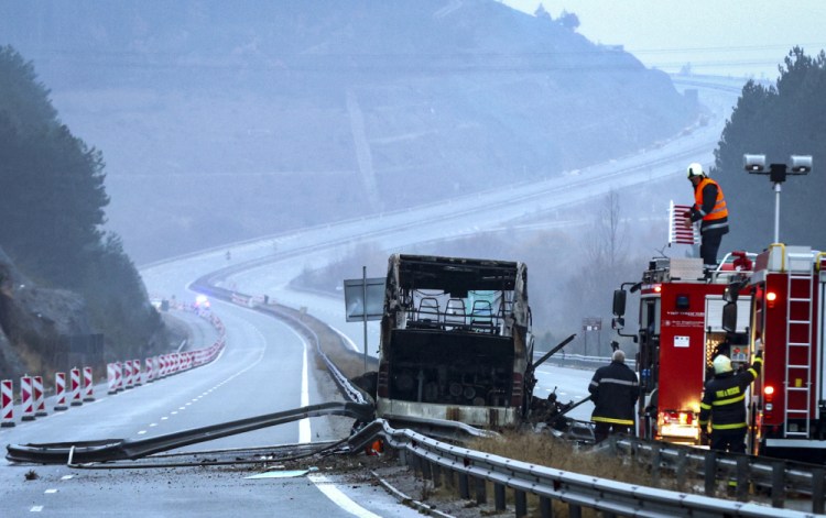 Firefighters and forensic workers inspect the scene of a bus crash killed at least 45 people in western Bulgaria on Tuesday.