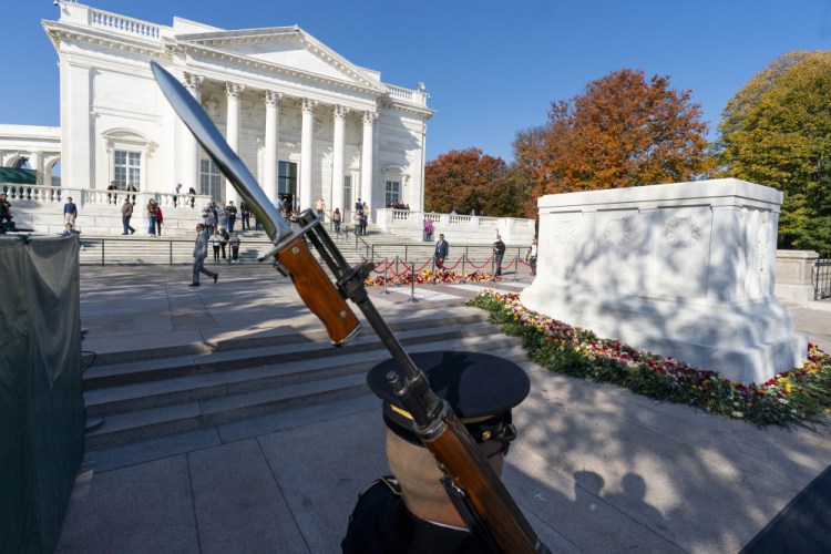 A tomb guard of the 3rd U.S. Infantry Regiment, known as "The Old Guard," stands during a centennial commemoration event at the Tomb of the Unknown Soldier, in Arlington National Cemetery, Wednesday, Nov. 10, 2021, in Arlington, Va. 