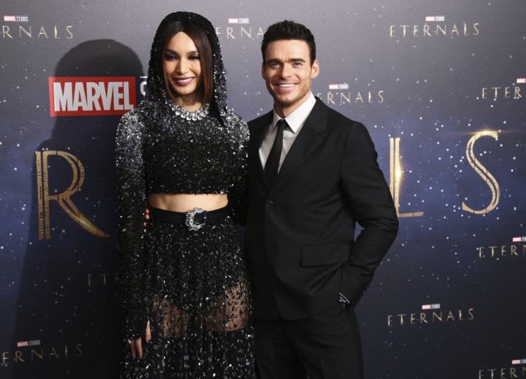 Gemma Chan and Richard Madden arrive  at the premiere of the film "Eternals" on Oct. 27 in London. 

