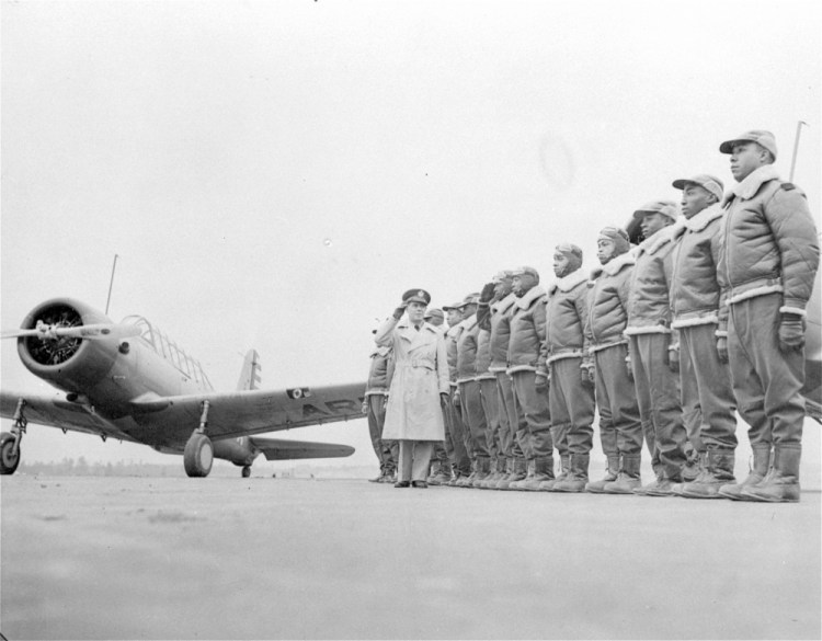 Major James A. Ellison, left, returns the salute of Mac Ross of Dayton, Ohio, as he inspects the cadets at the Basic and Advanced Flying School for Black United States Army Air Corps cadets at the Tuskegee Institute in Tuskegee, Ala., in Jan. 23, 1942. 