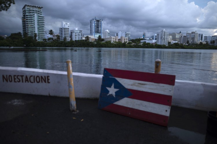 A wooden Puerto Rican flag is displayed on the dock of the Condado lagoon in San Juan, Puerto Rico in September 2021. 