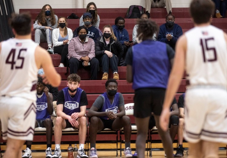 CUMBERLAND, ME - DECEMBER 1: Deering students watch as their team plays in a scrimmage against Greely in Cumberland on Wednesday, December 1, 2021. (Staff photo by Brianna Soukup/Staff Photographer)