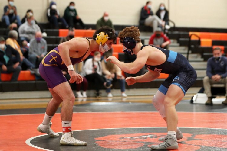 Cheverus High's Marshall Fowler squares off against York's James Holly during a wrestling meet at Biddeford High in mid-December.