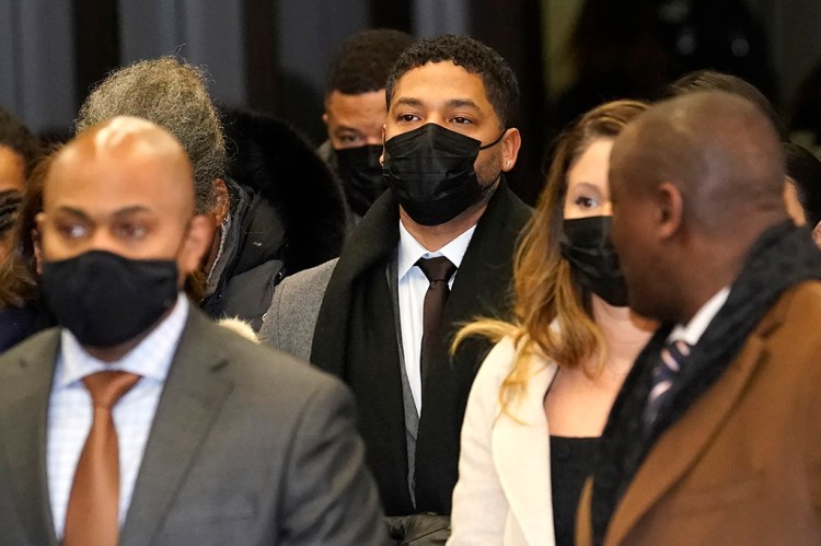 Actor Jussie Smollett, center, returns to the Leighton Criminal Courthouse in Chicago on Thursday after the jury reached its verdict in Smollett's trial.