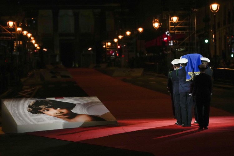 Pictures of Josephine Baker adorn the red carpet as the coffin with soils from the U.S., France and Monaco is carried toward the Pantheon monument in Paris on Tuesday, where Baker is to symbolically be inducted. 