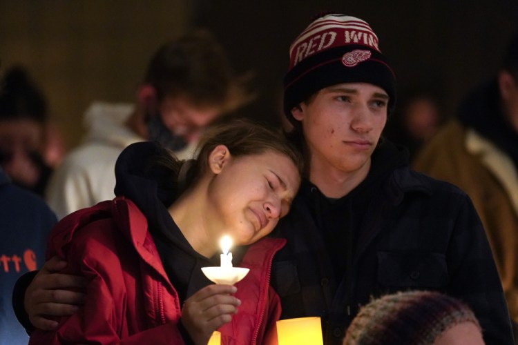 People attend a vigil at LakePoint Community Church in Oxford, Mich., on Tuesday, a day a 15-year-old sophomore allegedly opened fire at Oxford High School, killing four students and wounding seven, including a teacher. 