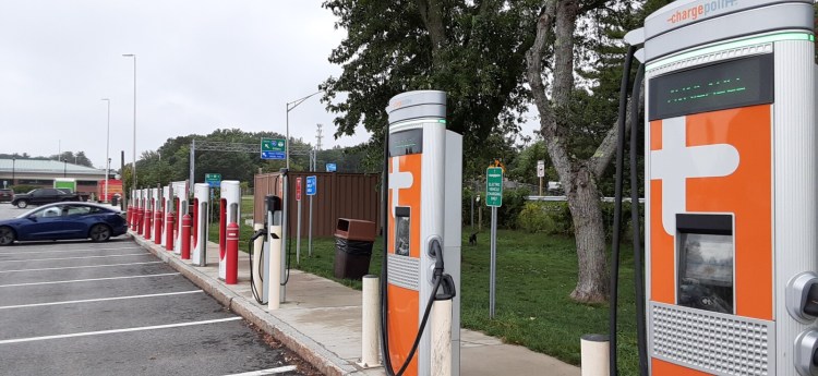 The electric vehicle charging station at the southbound Kennebunk Plaza on the Maine Turpike. Public funding for new vehicle incentives and charging stations to meet Maine's climate goals is lacking by an estimated figure of more than $100 million, according to a state-commissioned report.