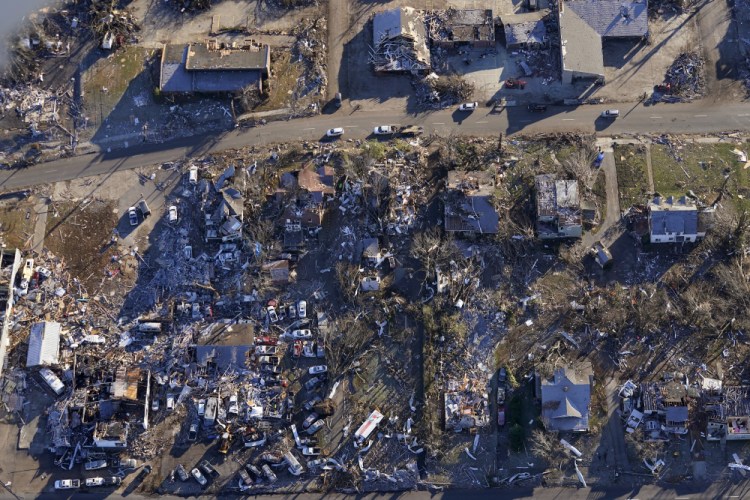 In this aerial photo, tornado destruction is seen in downtown Mayfield, Ky., on Sunday. (AP Photo/Gerald Herbert)