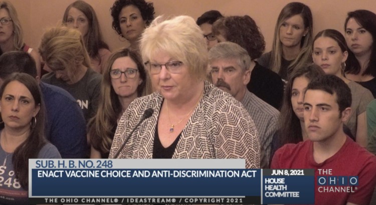 Dr. Sherri Tenpenny speaks at an Ohio House Health Committee in Columbus, Ohio, in June. The Cleveland-based osteopathic doctor testified to the bogus claim that COVID-19 vaccines cause magnetism. “They can put a key on their forehead; it sticks,” said Tenpenny. 