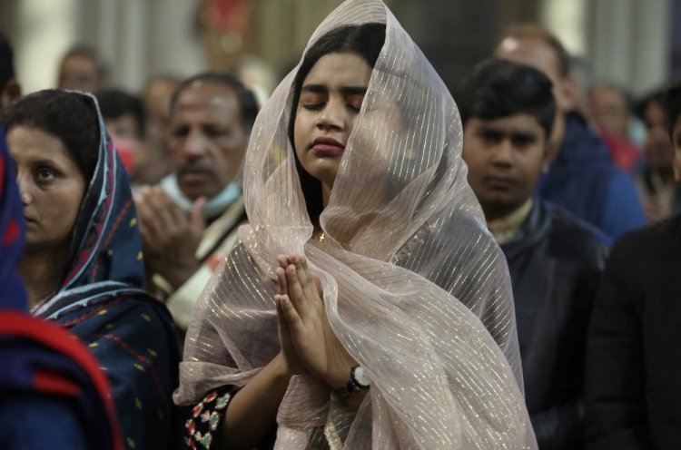 Christians attend a Christmas mass at Sacred Heart Cathedral in Lahore, Pakistan, on Saturday. 
