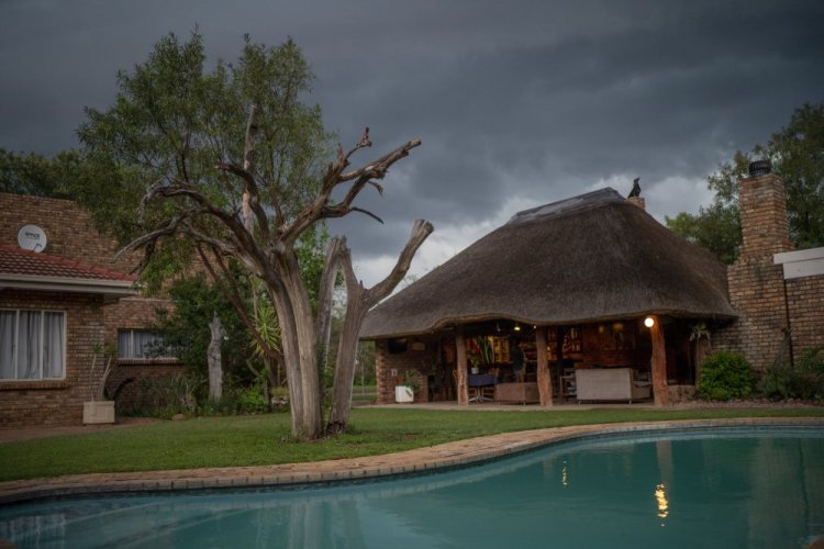 Storm clouds move over the Tamboti Bush Lodge in the Dinokeng Game Reserve near Hammanskraal, South Africa, on  Saturday. 


