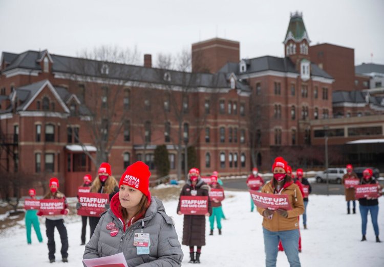 Jonica Frank, center, an operating room nurse at Maine Medical Center joins fellow nurses to demand increased protections in their work environments. The rally was one of many National Nurses United (NNU) events across the country on Thursday. 