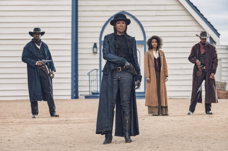 This image released by Netflix shows Regina King, center, from the film "The Harder They Fall." 