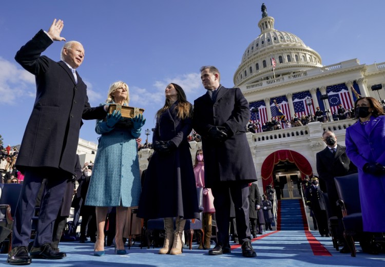 oe Biden is sworn in as the 46th president of the United States by Chief Justice John Roberts as Jill Biden holds the Bible during the 59th Presidential Inauguration at the U.S. Capitol in Washington, on Jan. 20, 2021, as their children Ashley and Hunter watch
