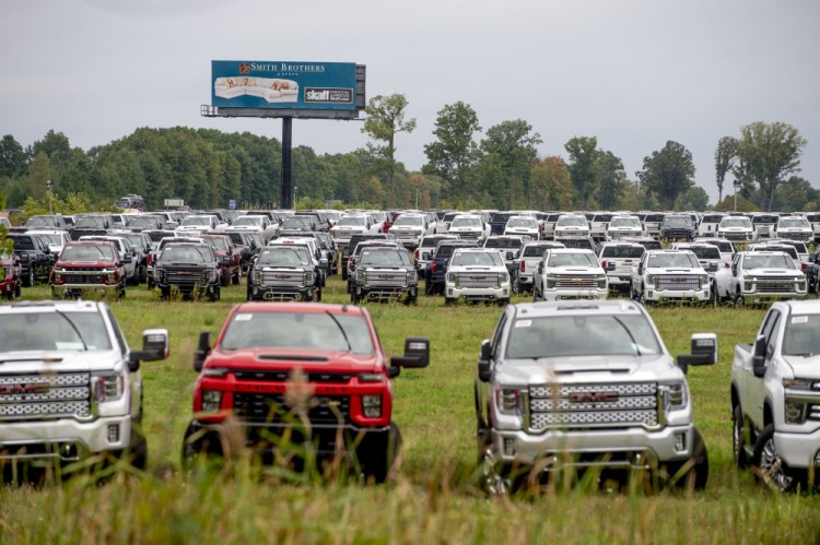 The Chevrolet Silverados and GMC Sierra pickups built at Flint Assembly are packed in September  2021 in Flint, Michigan. Chip shortages have disrupted auto production and driven up car prices.