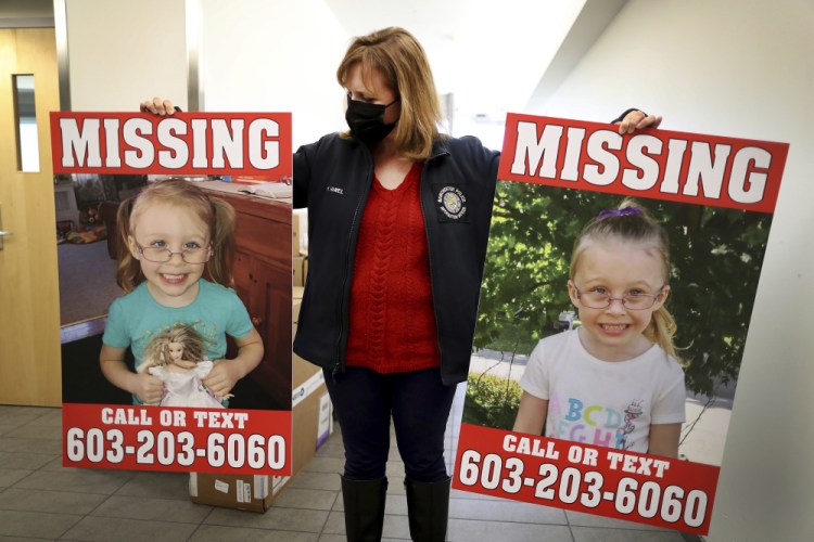 Manchester Police Public Information Officer Heather Hamel holds two reward posters, Tuesday, Jan. 4, 2022, in Manchester, N.H., that show missing girl Harmony Montgomery. 