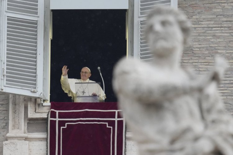 Pope Francis delivers the Angelus noon prayer in St. Peter's Square, at the Vatican, Sunday, Jan. 9, 2022.