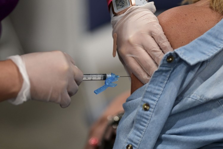 A health worker administers a Johnson & Johnson COVID-19 vaccine during a mass vaccination event at the Miramar Convention Center in San Juan, Puerto Rico, on March 31, 2021. Almost 85 percent of people in Puerto Rico have received the first dose and more than 70 percent have received the second one.