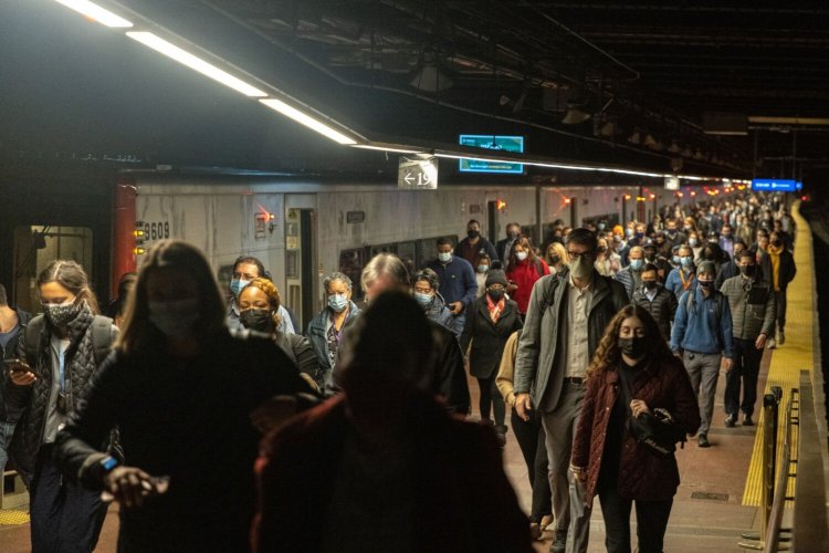 Commuters exit a Metro-North Railroad train at Grand Central Terminal in New York on Nov 18.