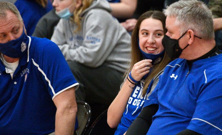 Lawrence's MaKenzie Nadeau chats with coaches on the bench during a Class A North game Tuesday night in Gardiner.