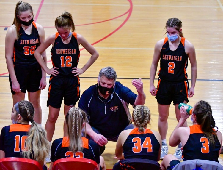 Skowhegan girls basketball coach Mike LeBlanc gives instructions to his team during a timeout of a Feb. 8 game against Cony in Augusta.
