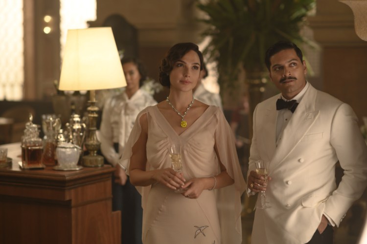 Gal Gadot, left, and Ali Fazal in a scene from "Death on the Nile."