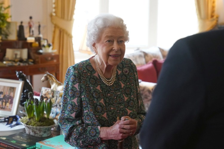 Queen Elizabeth II speaks during an audience at Windsor Castle on Wednesday. Buckingham Palace said Sunday the Queen tested positive for COVID-19, has mild symptoms and will continue with duties. 