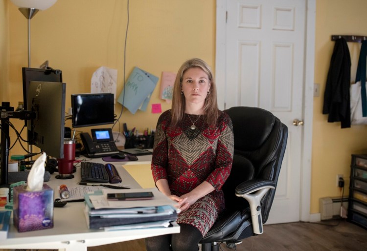 Attorney Taylor Kilgore in her home office in Turner. Kilgore takes child protective cases, representing parents in their cases with the Department of Health and Human Services. But she has scaled back recently because of burnout, long hours and state pay that many lawyers argue is too low for the work. 