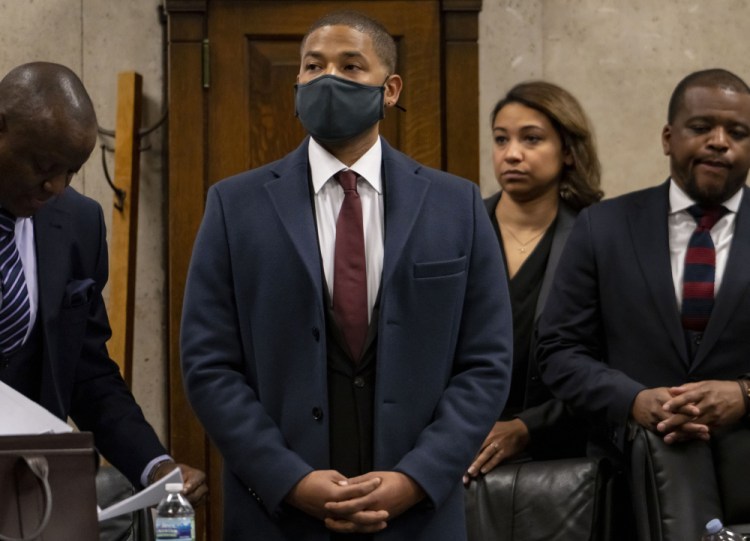 Actor Jussie Smollett appears with his attorneys at his sentencing hearing Thursday in Chicago. Smollett insisted that he is innocent.