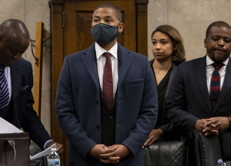 Actor Jussie Smollett appears with his attorneys at his sentencing hearing Thursday in Chicago. Smollett insisted that he is innocent.