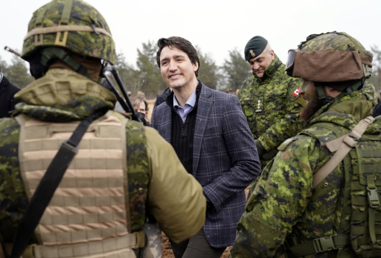 Canadian Prime Minister Justin Trudeau speaks to Canadian troops during his visit to Adazi Military base in Kadaga, Latvia, on Tuesday.