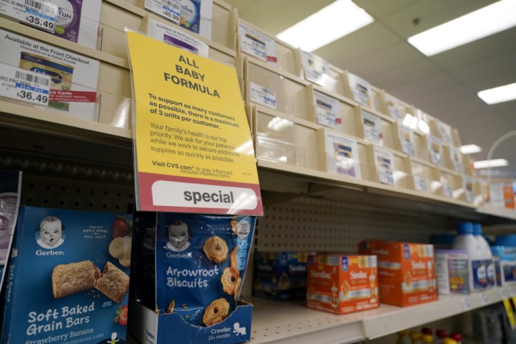 A sign is posted at a CVS  indicating a shortage in  baby food on Tuesday in Charlotte, N.C. The shortages are especially dangerous for infants who require specialty formulas due to food allergies or digestive problems. 
