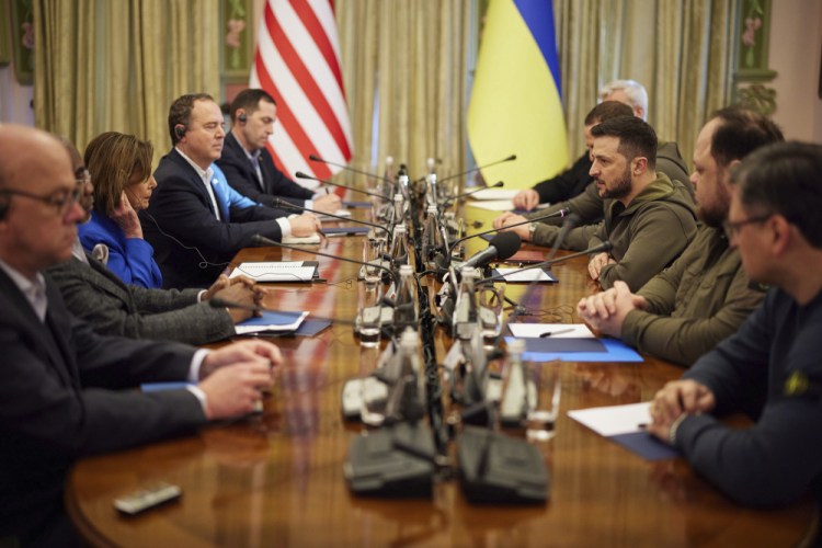 Ukrainian President Volodymyr Zelensky, third from right, and U.S. Speaker of the House Nancy Pelosi, third from left, talk during their meeting Saturday in Kyiv, Ukraine. Pelosi is the highest-ranking American leader to visit Ukraine since the start of the war, and her visit marks a major show of continuing support for the country's struggle against Russia.