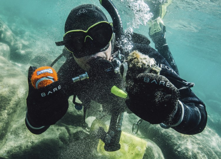 A Clean Up The Lake diver shows debris found in the lake from an initial dive in 2020, at Lake Tahoe.