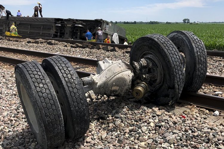Debris sits near railroad tracks after an Amtrak passenger train derailed Monday near Mendon, Mo. The Southwest Chief, traveling from Los Angeles to Chicago, was carrying about 243 passengers when it collided with a dump truck near Mendon, Amtrak spokeswoman Kimberly Woods said.
