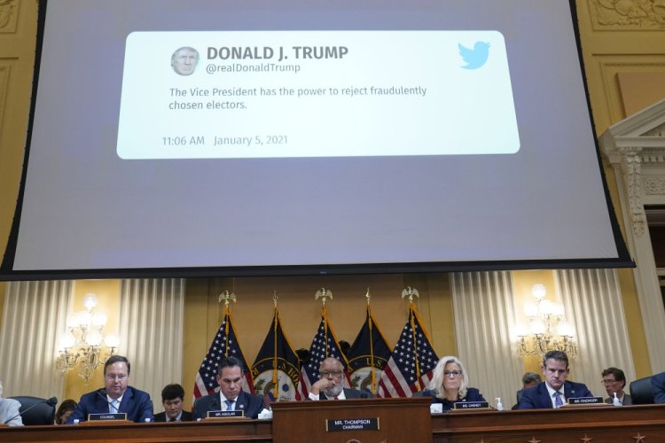 A tweet from former President Donald Trump is displayed on a screen as the House select committee investigating the Jan. 6, 2021, attack on the Capitol holds a hearing Thursday at the Capitol in Washington.
