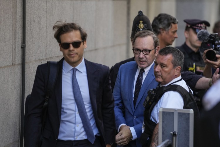 Actor Kevin Spacey, center, arrives at the Old Bailey, in London, on Thursday.