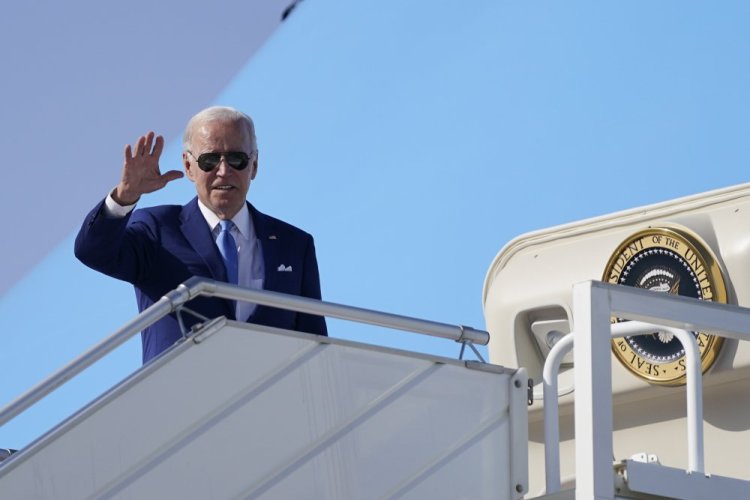 President Biden waves before departure Saturday in Jeddah, Saudi Arabia.