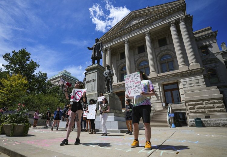 Abortion rights demonstrators protest outside the Indiana Statehouse on Friday during the ongoing special session to debate a bill to restrict abortions. 