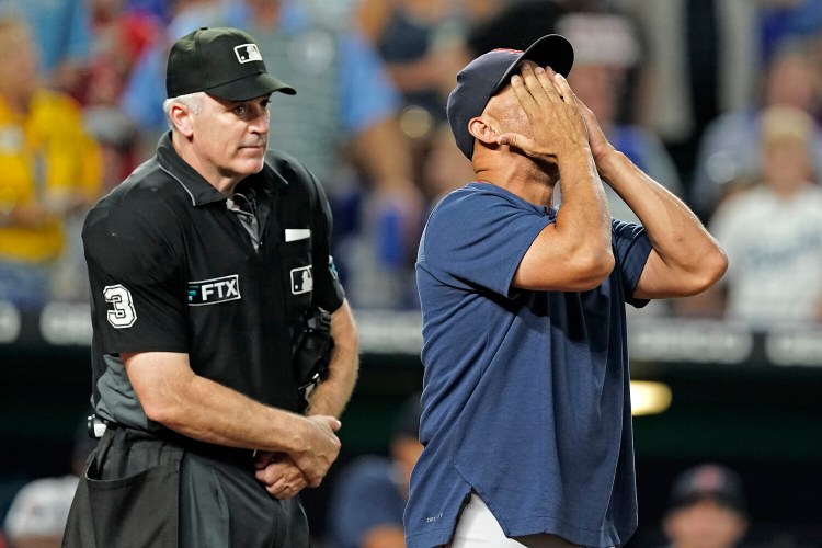 Boston Red Sox manager Alex Cora argues a call with home plate umpire Bill Welke during the seventh inning of a baseball game against the Kansas City Royals Thursday in Kansas City, Missouri
