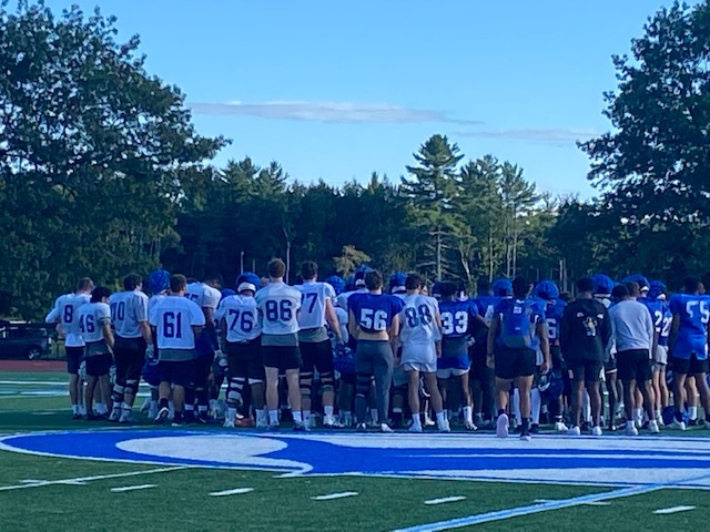 The Colby College football team huddles at the end of practice on Wednesday at Harold Alfond Stadium in Waterville.