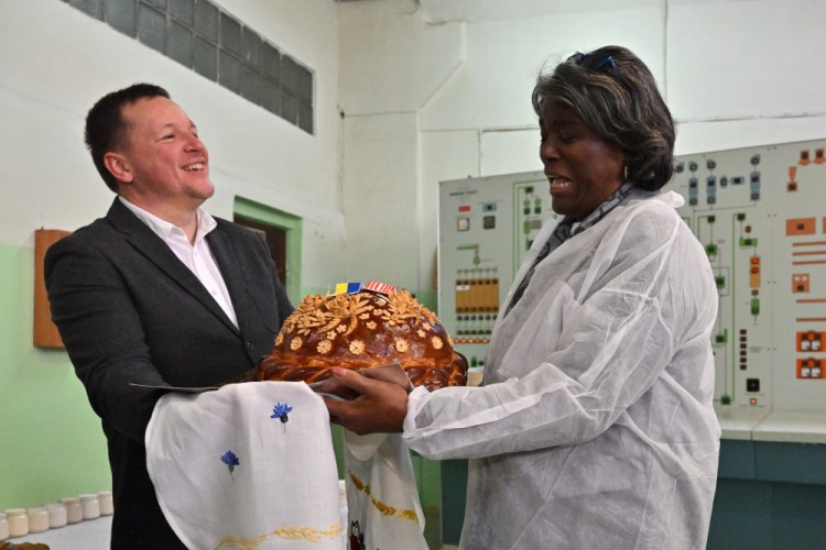 Linda Thomas-Greenfield, U.S. ambassador to the United Nations, right, visits Ukraine's Kyiv Mlyn flour mill on Tuesday. The grain deal between Russia and Ukraine is set to expire Nov. 19 unless they reach a renewal agreement.