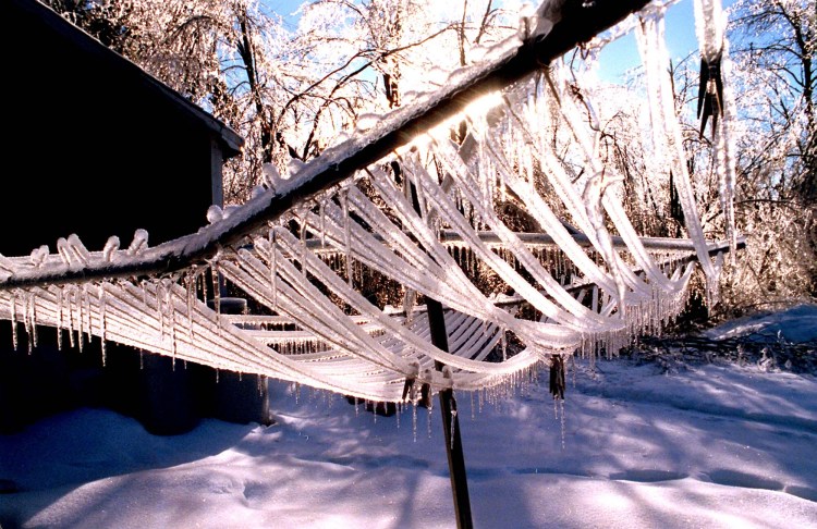 STAFF PHOTO BY DOUG JONES -- Monday, January 12, 1998 -- Even the mundane becomes ethereal when coated in ice . This along Rt. 107 in Bridgton.