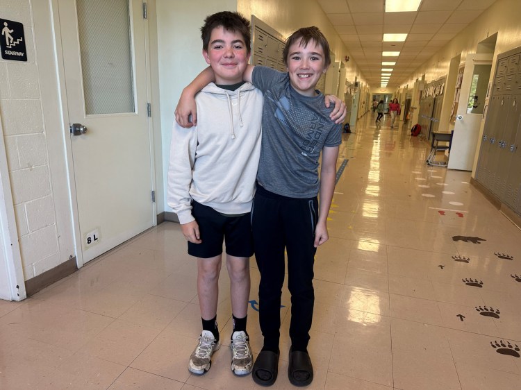 Oscar Stanton, left, and Tate Graham, fifth graders at Loranger Memorial School, led an effort to designate the Pink-edged Sulphur as Maine's state butterfly. 