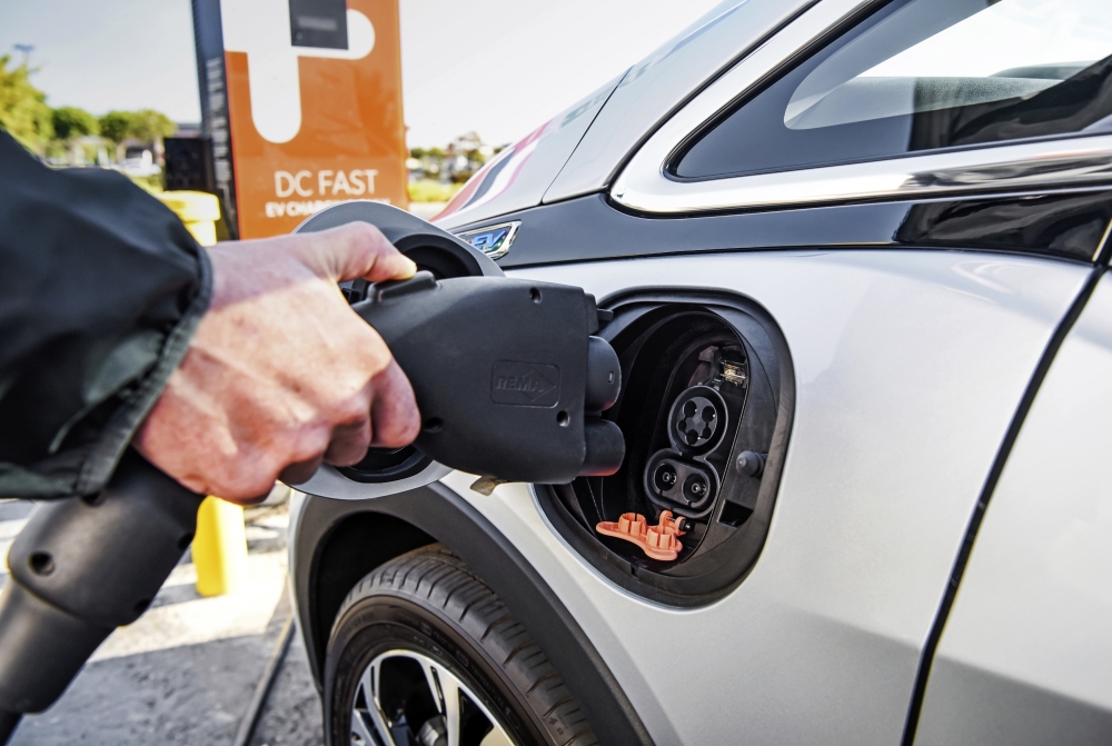 Behind The Wheel Tesla EV Plug
