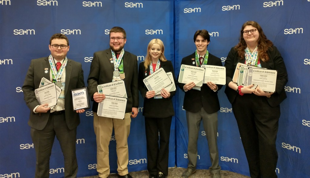 Students from Thomas College received awards at a business conference.