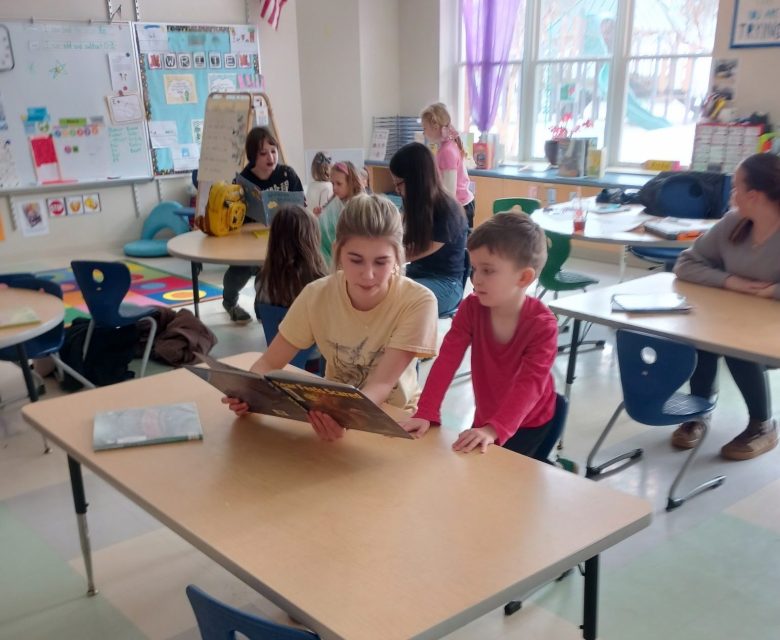 Farmington middle schoolers connect to young readers though buddy program